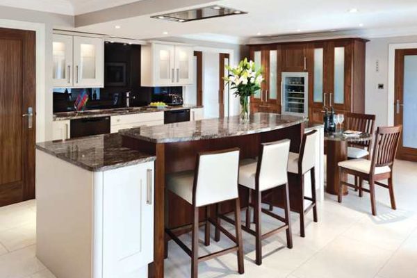 Urban kitchen design with granite dining table and cherry wood chairs in Glenview residential property